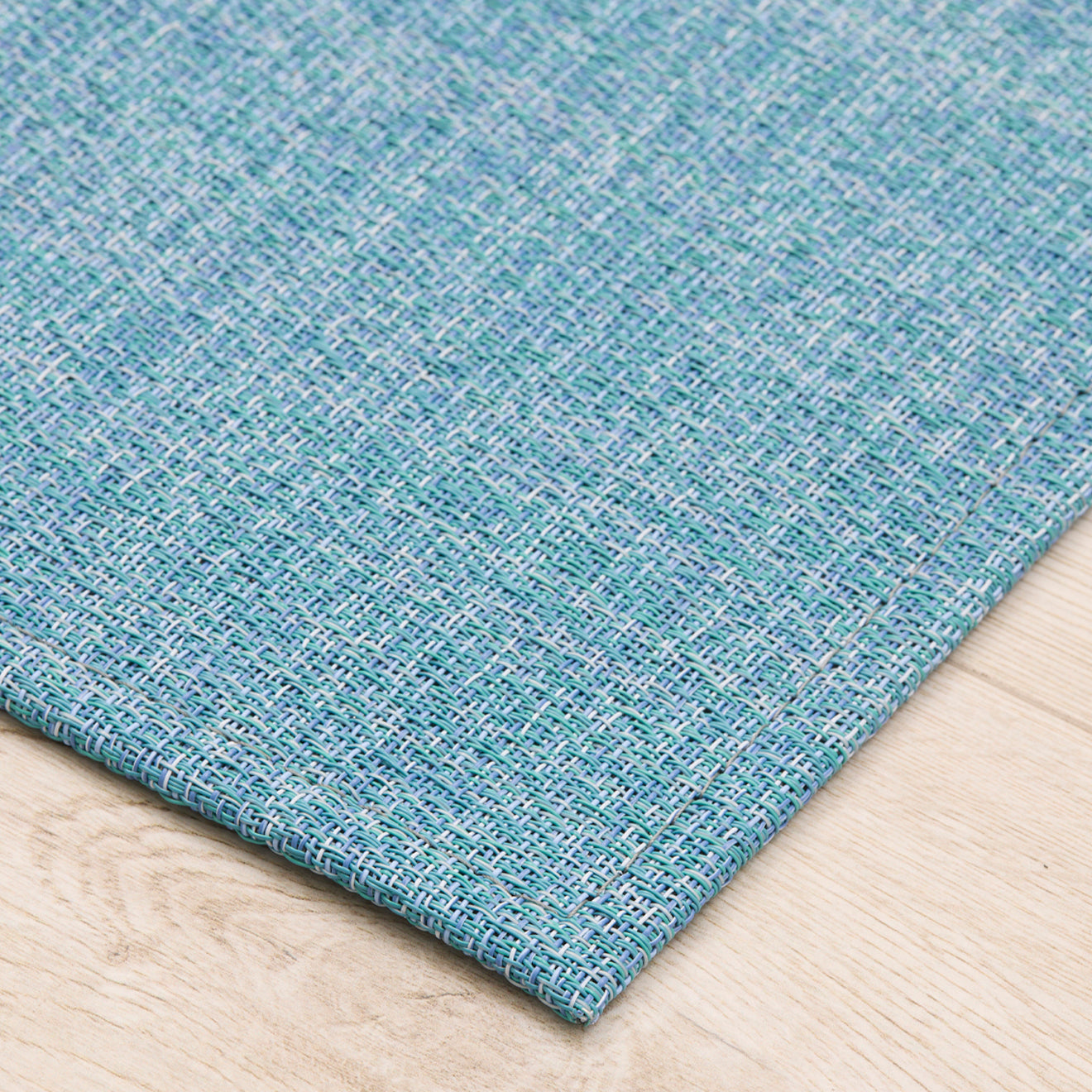 Detail image of Chilewich woven material showcasing texture, color, and pattern of the terrastrand yarn weave.