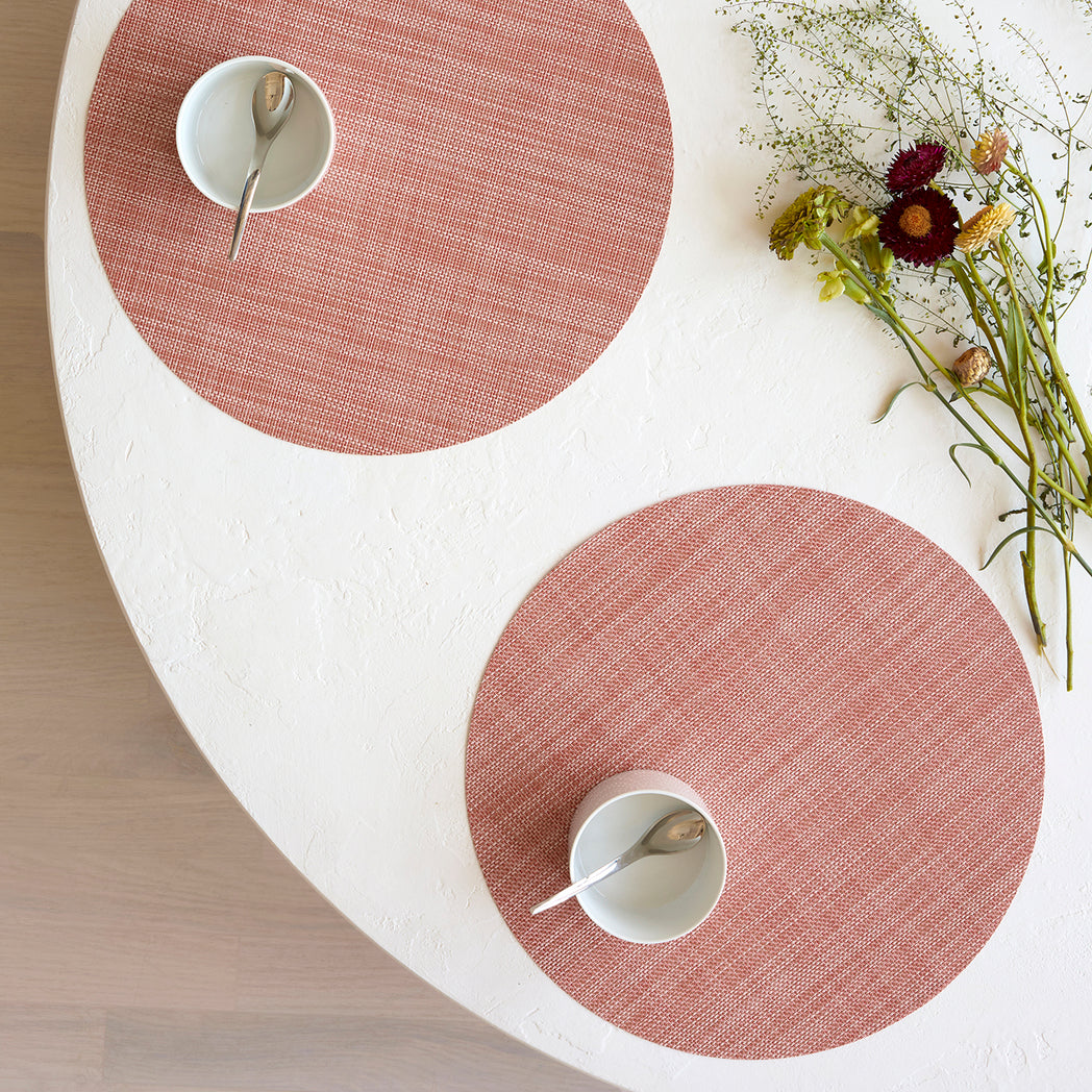 Chilewich Basketweave floor mat in clay, showcasing woven terrastrand yarn texture and modern design aesthetic.