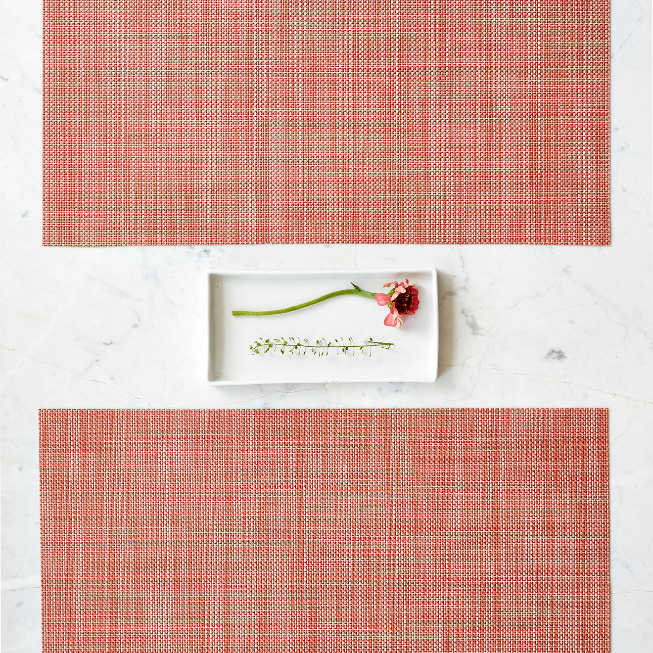 Chilewich Basketweave floor mat in clay, showcasing woven terrastrand yarn texture and modern design aesthetic.