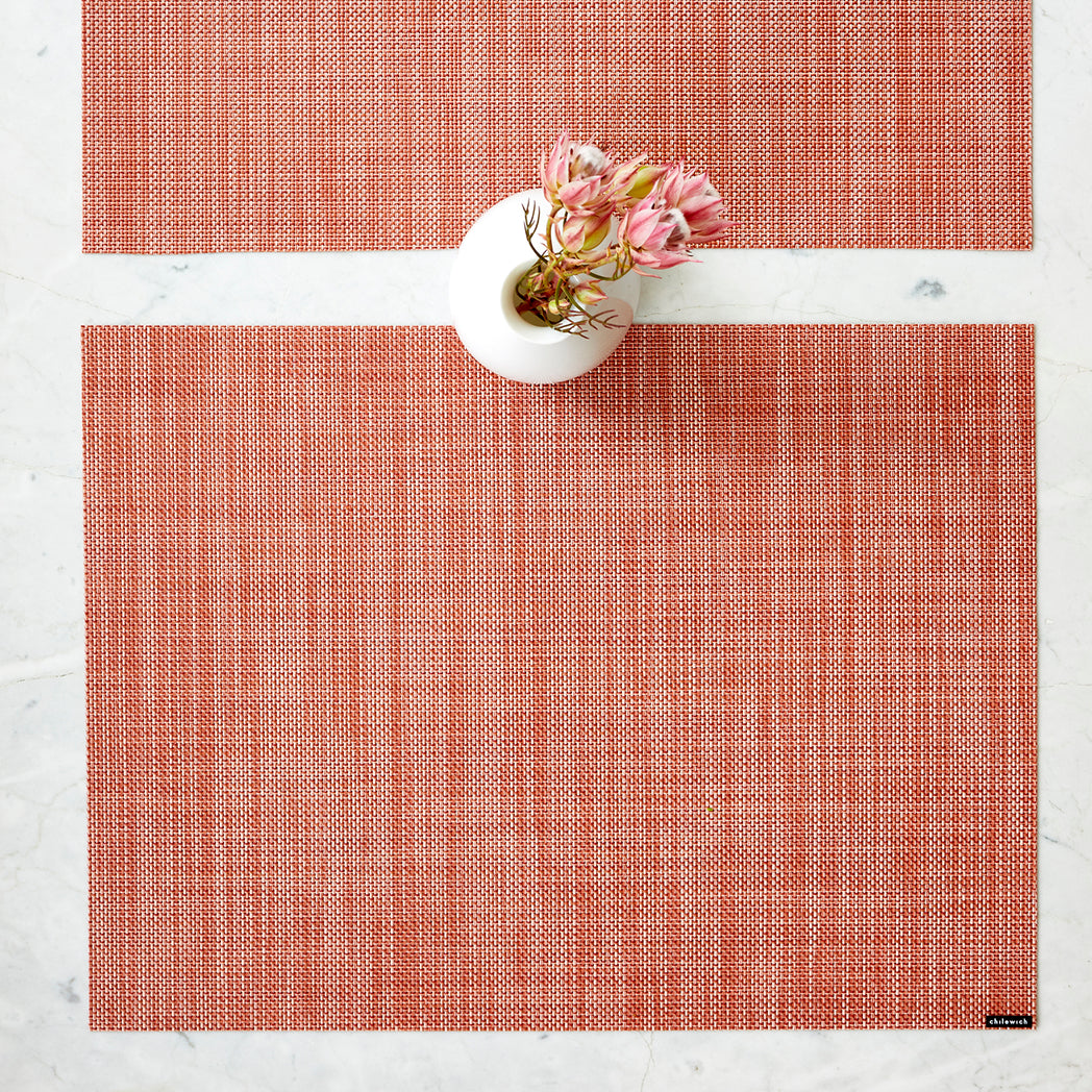 Chilewich Basketweave floor mat in clay, showcasing woven terrastrand yarn texture and modern design aesthetic.